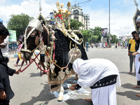 A Shiite Muslim woman is breaking down as she mourns during a procession to mark Ashura, in south Kolkata, India, on July 17, 2024. Ashura i...