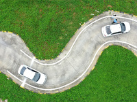 A trainee is practicing driving on the training ground of Jindun Driver Training School in Chaohu City, Anhui province, China, on July 17, 2...