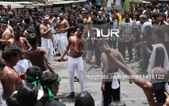 Shi'ite Muslims are flagellating themselves during a Muharram procession marking Ashura, in Kolkata, India, on July 17, 2024. 