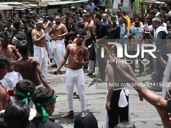 Shi'ite Muslims are flagellating themselves during a Muharram procession marking Ashura, in Kolkata, India, on July 17, 2024. (