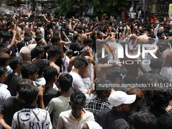 Shi'ite Muslims are flagellating themselves during a Muharram procession marking Ashura, in Kolkata, India, on July 17, 2024. (