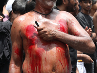 A Shi'ite Muslim is flagellating himself during a Muharram procession marking Ashura in Kolkata, India, on July 17, 2024. (