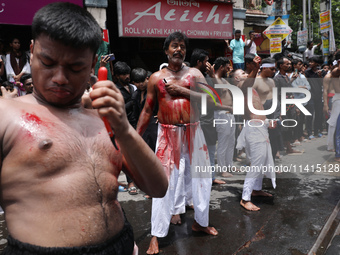 Shi'ite Muslims are flagellating themselves during a Muharram procession marking Ashura, in Kolkata, India, on July 17, 2024. (