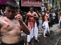 Shi'ite Muslims are flagellating themselves during a Muharram procession marking Ashura, in Kolkata, India, on July 17, 2024. (