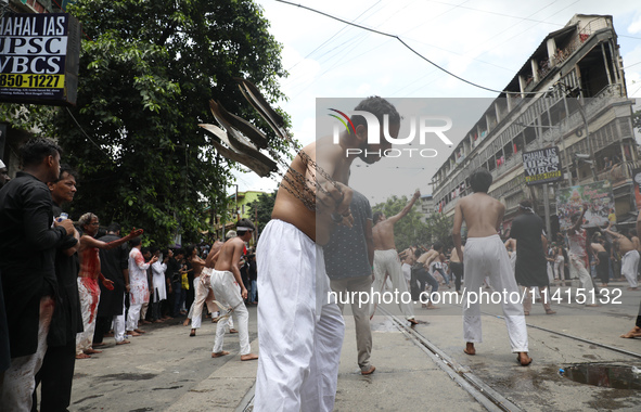 Shi'ite Muslims are flagellating themselves during a Muharram procession marking Ashura, in Kolkata, India, on July 17, 2024. 