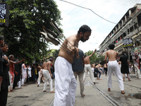 Shi'ite Muslims are flagellating themselves during a Muharram procession marking Ashura, in Kolkata, India, on July 17, 2024. (