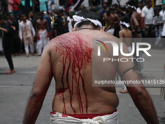 A Shi'ite Muslim is bleeding after flagellating himself during a Muharram procession marking Ashura, in Kolkata, India, on July 17, 2024. (