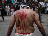 A Shi'ite Muslim is bleeding after flagellating himself during a Muharram procession marking Ashura, in Kolkata, India, on July 17, 2024. (