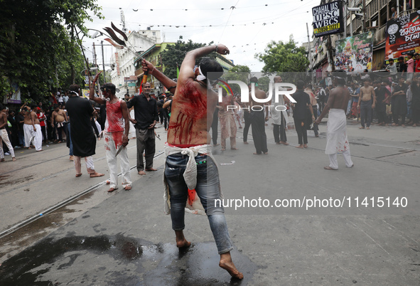 Shi'ite Muslims are flagellating themselves during a Muharram procession marking Ashura, in Kolkata, India, on July 17, 2024. 