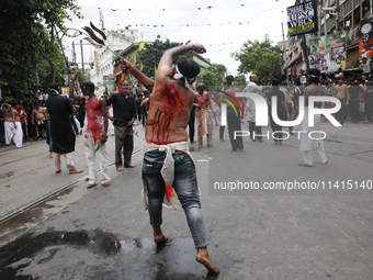 Shi'ite Muslims are flagellating themselves during a Muharram procession marking Ashura, in Kolkata, India, on July 17, 2024. (