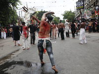 Shi'ite Muslims are flagellating themselves during a Muharram procession marking Ashura, in Kolkata, India, on July 17, 2024. (