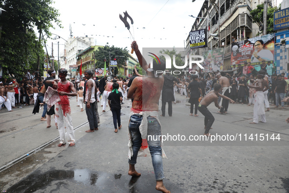 Shi'ite Muslims are flagellating themselves during a Muharram procession marking Ashura, in Kolkata, India, on July 17, 2024. 