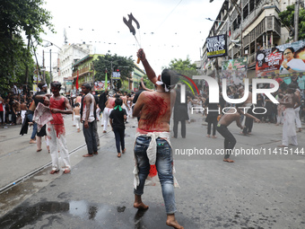 Shi'ite Muslims are flagellating themselves during a Muharram procession marking Ashura, in Kolkata, India, on July 17, 2024. (