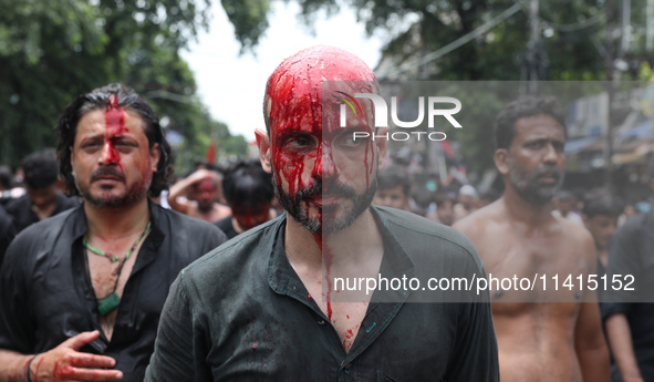 Shi'ite Muslims are walking after flagellating themselves during a Muharram procession marking Ashura in Kolkata, India, on July 17, 2024. 