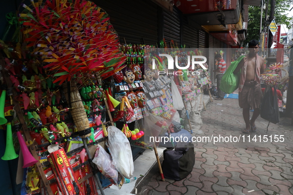 A vendor is arranging toys for selling during a Muharram procession marking Ashura, in Kolkata, India, on July 17, 2024. 