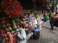 A vendor is arranging toys for selling during a Muharram procession marking Ashura, in Kolkata, India, on July 17, 2024. (