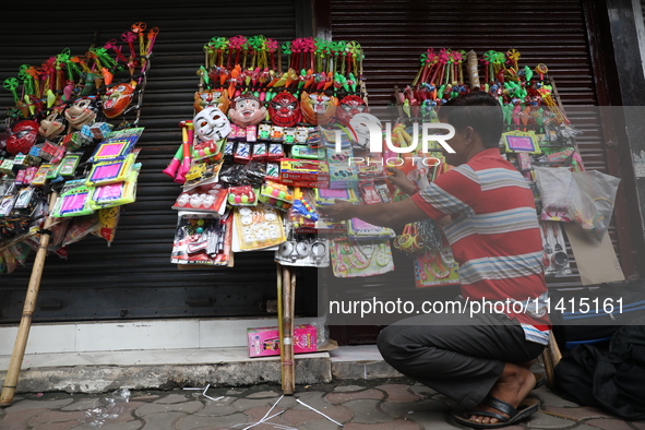 A vendor is arranging toys for selling during a Muharram procession marking Ashura, in Kolkata, India, on July 17, 2024. 