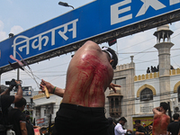 Shiite Muslims are flagellating themselves during a procession to mark Ashura, in the old quarters of New Delhi, India, on July 17, 2024. As...