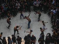 Shiite Muslims are flagellating themselves during a procession to mark Ashura, in the old quarters of New Delhi, India, on July 17, 2024. As...