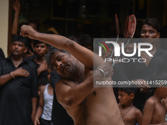 Shiite Muslims are flagellating themselves during a procession to mark Ashura, in the old quarters of New Delhi, India, on July 17, 2024. As...