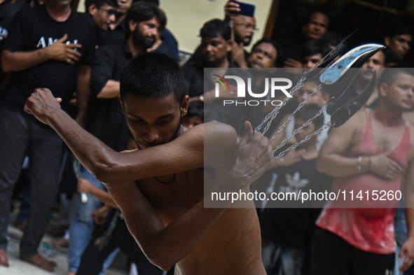 Shiite Muslims are flagellating themselves during a procession to mark Ashura, in the old quarters of New Delhi, India, on July 17, 2024. As...