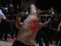 Shiite Muslims are flagellating themselves during a procession to mark Ashura, in the old quarters of New Delhi, India, on July 17, 2024. As...