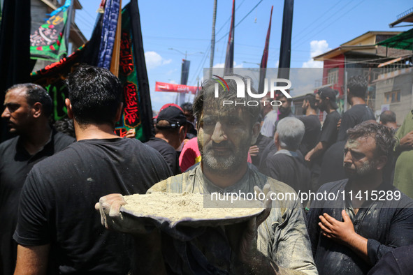 Kashmiri Shiite Muslim mourners are taking part in a religious procession on the tenth day of Ashura in the Islamic month of Muharram in Sri...