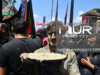 Kashmiri Shiite Muslim mourners are taking part in a religious procession on the tenth day of Ashura in the Islamic month of Muharram in Sri...