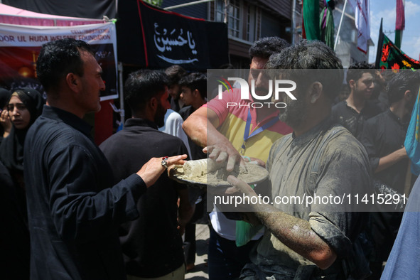 Kashmiri Shiite Muslim mourners are taking part in a religious procession on the tenth day of Ashura in the Islamic month of Muharram in Sri...