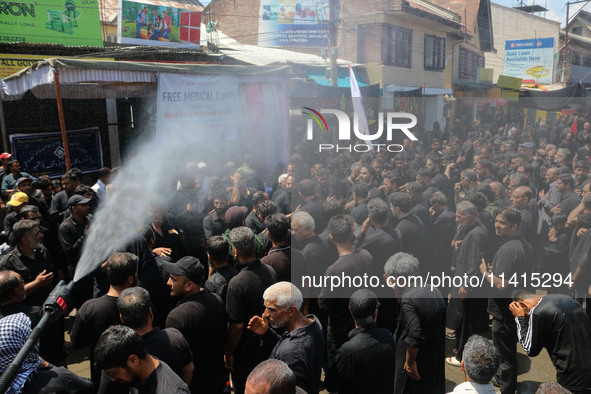 Kashmiri Shiite Muslim mourners are taking part in a religious procession on the tenth day of Ashura in the Islamic month of Muharram in Sri...