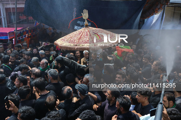 Kashmiri Shiite Muslim mourners are taking part in a religious procession on the tenth day of Ashura in the Islamic month of Muharram in Sri...