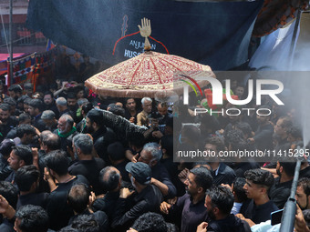 Kashmiri Shiite Muslim mourners are taking part in a religious procession on the tenth day of Ashura in the Islamic month of Muharram in Sri...