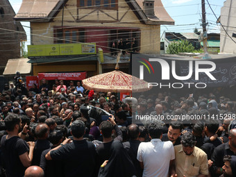 Kashmiri Shiite Muslim mourners are taking part in a religious procession on the tenth day of Ashura in the Islamic month of Muharram in Sri...