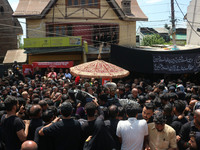 Kashmiri Shiite Muslim mourners are taking part in a religious procession on the tenth day of Ashura in the Islamic month of Muharram in Sri...