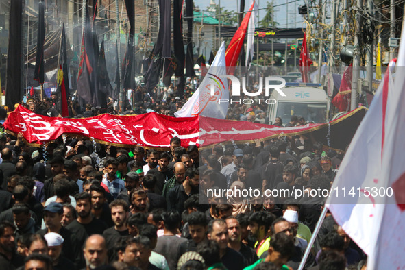 Kashmiri Shiite Muslim mourners are taking part in a religious procession on the tenth day of Ashura in the Islamic month of Muharram in Sri...