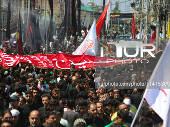 Kashmiri Shiite Muslim mourners are taking part in a religious procession on the tenth day of Ashura in the Islamic month of Muharram in Sri...