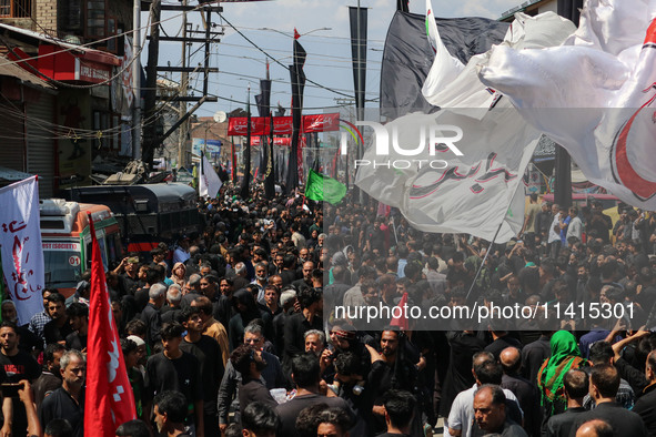 Kashmiri Shiite Muslim mourners are taking part in a religious procession on the tenth day of Ashura in the Islamic month of Muharram in Sri...