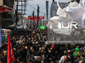 Kashmiri Shiite Muslim mourners are taking part in a religious procession on the tenth day of Ashura in the Islamic month of Muharram in Sri...