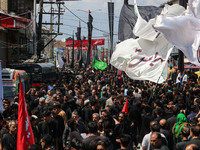 Kashmiri Shiite Muslim mourners are taking part in a religious procession on the tenth day of Ashura in the Islamic month of Muharram in Sri...