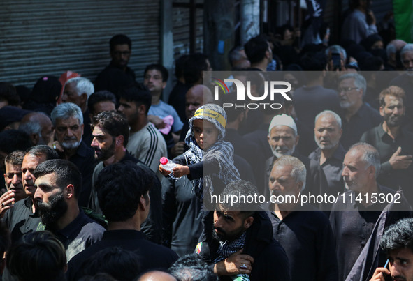 Kashmiri Shiite Muslim mourners are taking part in a religious procession on the tenth day of Ashura in the Islamic month of Muharram in Sri...