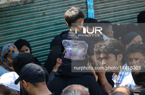 Kashmiri Shiite Muslim mourners are taking part in a religious procession on the tenth day of Ashura in the Islamic month of Muharram in Sri...