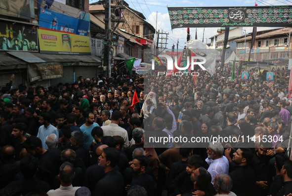 Kashmiri Shiite Muslim mourners are taking part in a religious procession on the tenth day of Ashura in the Islamic month of Muharram in Sri...