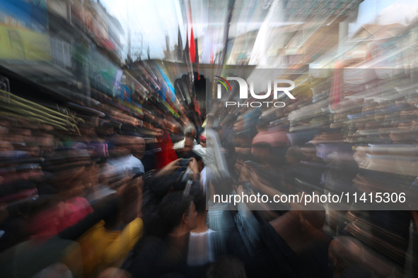 A Shiite Muslim girl is looking on during a religious procession on the tenth day of Ashura in the Islamic month of Muharram in Srinagar, Ja...