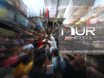 A Shiite Muslim girl is looking on during a religious procession on the tenth day of Ashura in the Islamic month of Muharram in Srinagar, Ja...