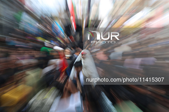 A Shiite Muslim girl is looking on during a religious procession on the tenth day of Ashura in the Islamic month of Muharram in Srinagar, Ja...