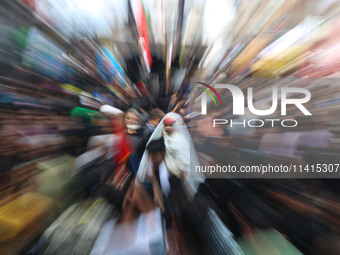 A Shiite Muslim girl is looking on during a religious procession on the tenth day of Ashura in the Islamic month of Muharram in Srinagar, Ja...