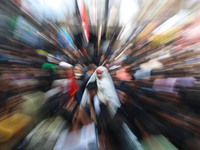 A Shiite Muslim girl is looking on during a religious procession on the tenth day of Ashura in the Islamic month of Muharram in Srinagar, Ja...