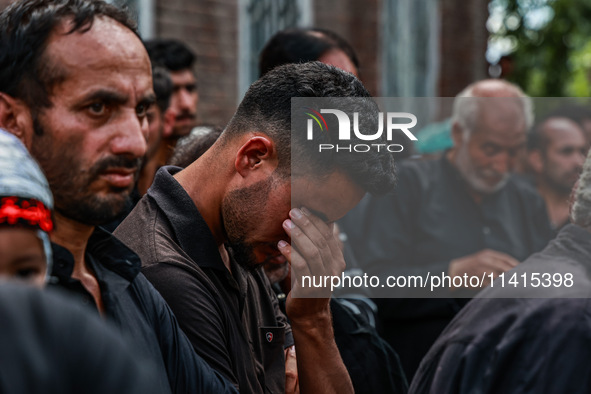 Kashmiri Shiite Muslims are chanting religious slogans as they take part in an Ashura procession during Muharram in Sopore, Jammu and Kashmi...