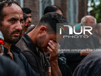 Kashmiri Shiite Muslims are chanting religious slogans as they take part in an Ashura procession during Muharram in Sopore, Jammu and Kashmi...