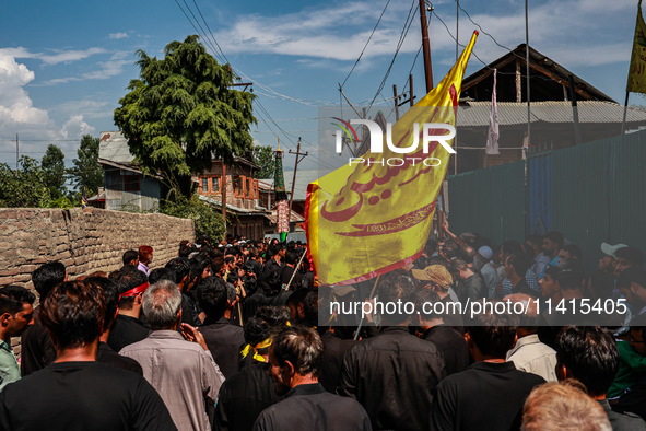 Kashmiri Shiite Muslims are chanting religious slogans as they take part in an Ashura procession during Muharram in Sopore, Jammu and Kashmi...